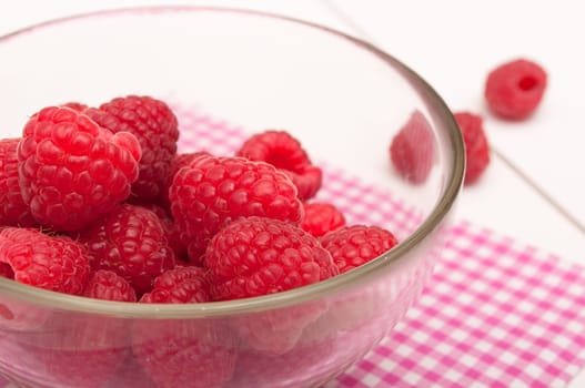 Fresh Raspberries in Bowl on White Table