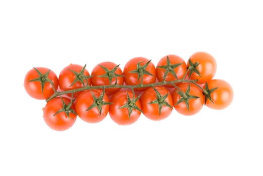 Ripe tomatoes on the green branch.