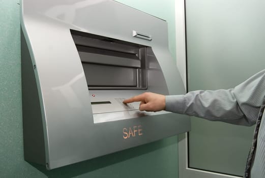 businessman entering the bank safe or secure data by keypad