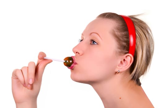 Beautiful girl sucking lollipop on white