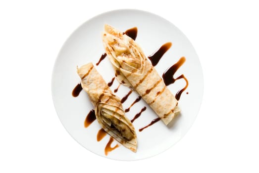 pancake dessert at plate isplated on white. top view.