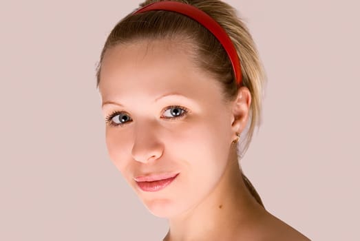 Beautiful blond girl with red hair band