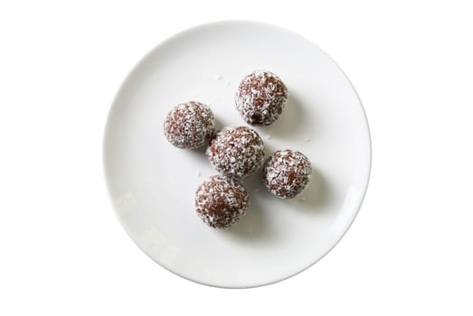 Chocolate ball cakes at plate isolated on white background