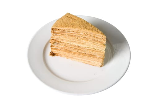 Piece of a pie at plate on white