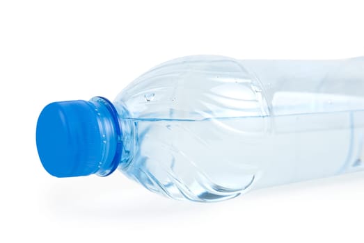 Close up of bottle with drinking water isolated on white