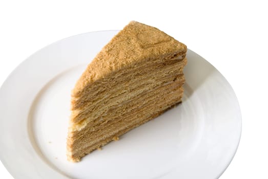 Piece of a pie at plate on white