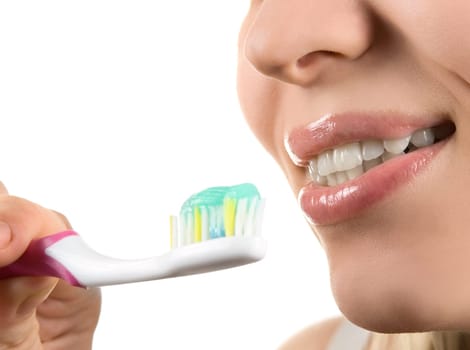 Close up of cleaning teeth on white