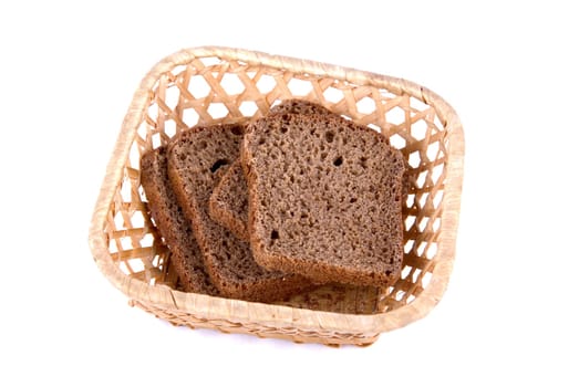 Bread at basket isolated on white
