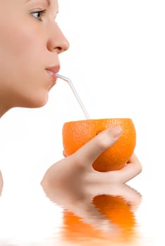 Pretty girl drink orange juice on white