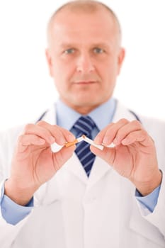 Stop smoking mature doctor male breaks cigarette focus on hand