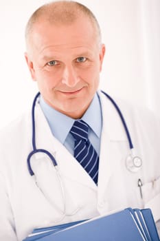 Professional senior doctor male with stethoscope portrait with document folders