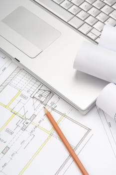 Architect workplace - architecture blueprints, pencil and laptop