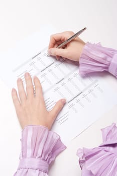 Woman filling the form on job interview. Top view.