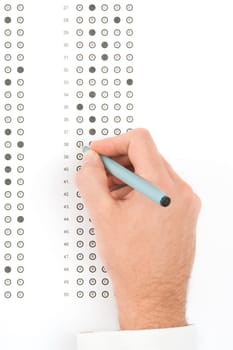 Student complete the questionnaire - school exam concept. Top view