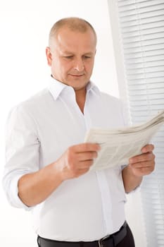 Happy senior businessman professional portrait read newspapers white shirt