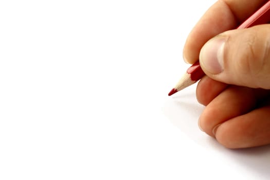 Hand with red pencil