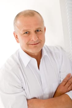 Happy successful mature businessman professional portrait smiling crossed arms