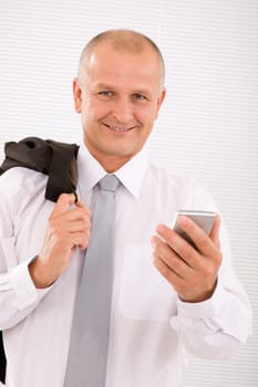 Mature handsome businessman wear suit with phone jacket over shoulder