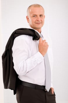 Successful mature businessman professional portrait jacket over shoulder