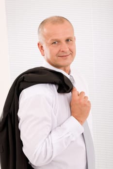 Successful mature businessman professional portrait jacket over shoulder