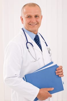 Professional senior doctor male with stethoscope portrait with document folders