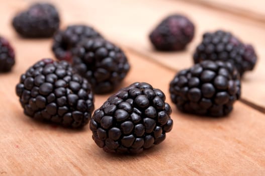 Fresh Ripe Raspberries on Old Wooden Table