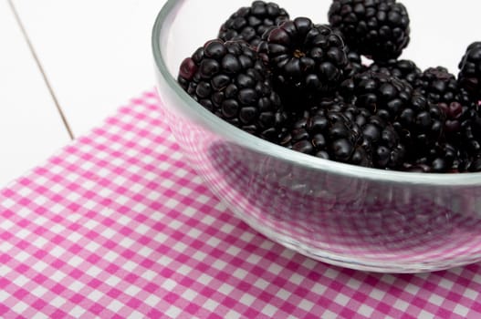 Fresh Blackberries in Glass Bowl on White Table