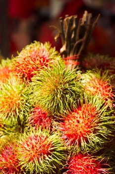 rambutan fruits on sale in asia street, exotic tropical fruit.