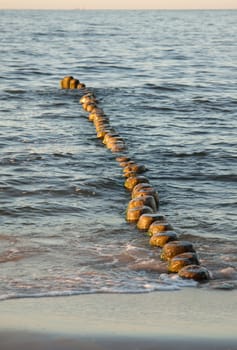 Logs in the water as breakwaters