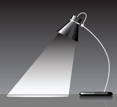desk lamp with a black background, with a empty space under spotlight.