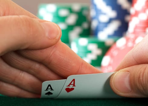 players hand, two aces