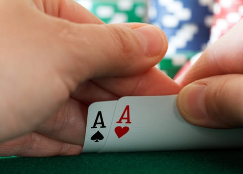 players hand, two aces