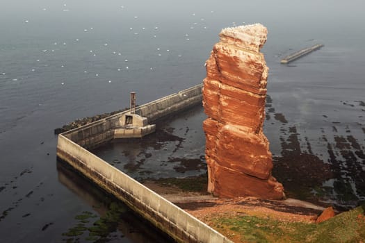 The cliffs of Heligoland with Heligoland's landmark,the Lange Anna