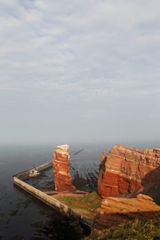 The cliffs of Heligoland with Heligoland's landmark,the Lange Anna