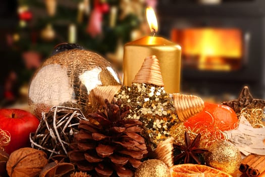 Colorful Christmas plate in front of Christmas tree and fireplace.