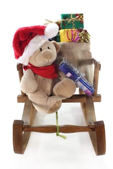 a teddy bear with many colorful Christmas gifts