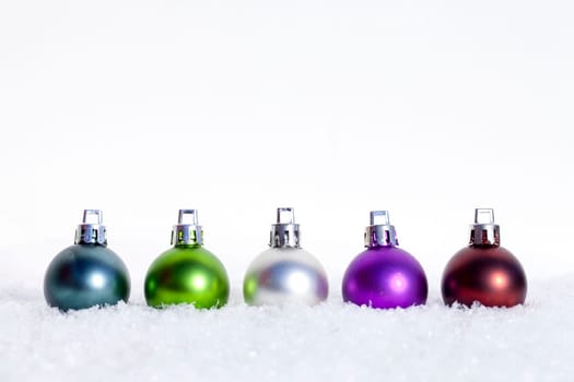 Christmas baubles in the snow