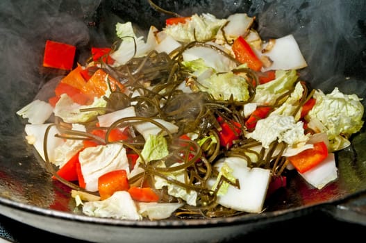 Algae,Chinese cabbage and peppers in a wok
