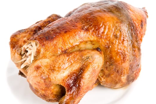 Close up of Tasty Crispy Roast Chicken on white plate
