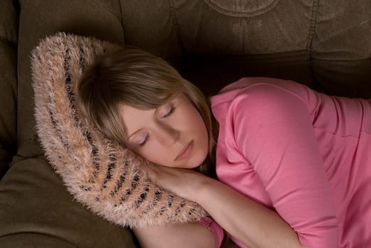 pretty sleeping woman at sofa