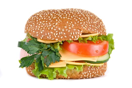 Hamburger with cheese tomatoes cucumbers and lettuce isolated on white