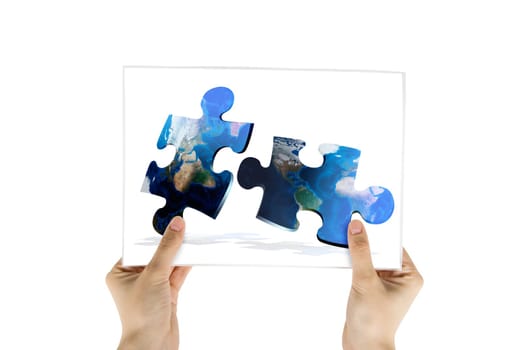 Hand hold photo of global map puzzles communication on white background