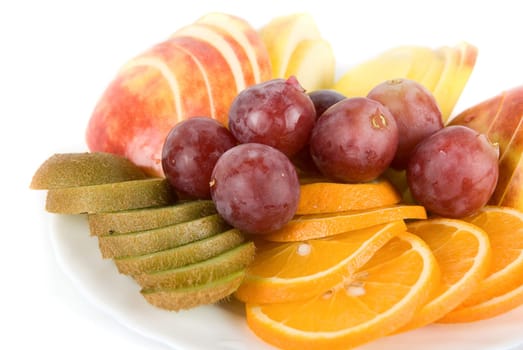 Healthy combination of fresh fruits with orange, kiwi, grapes and apple