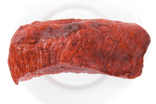Piece of a beef on plate isolated on white