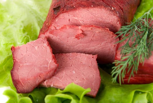 Close up of fresh lettuce and beef meat isolated on white