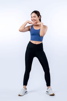 Full body asian woman in sportswear portrait, smiling and posing cheerful gesture. Workout training with attractive girl engage in her pursuit of healthy lifestyle. Isolated background Vigorous