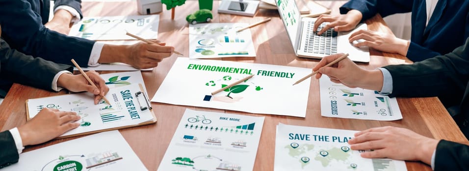 Eco business company meeting with group of business people planning strategy and discuss marketing of eco-friendly and renewable clean energy products. Green business company concept. Trailblazing