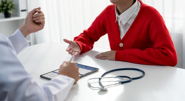 Patient attend doctor's appointment at clinic or hospital office, discussing medical treatment options and explaining examination results or medical record about sickness. Panorama Rigid