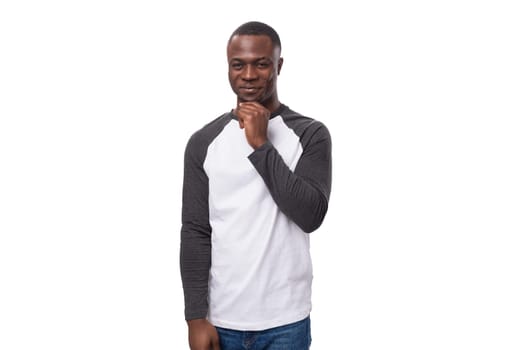 portrait of a young american guy with a short haircut dressed in a long sleeve sweater.