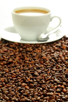 Composition with cup and coffee beans
